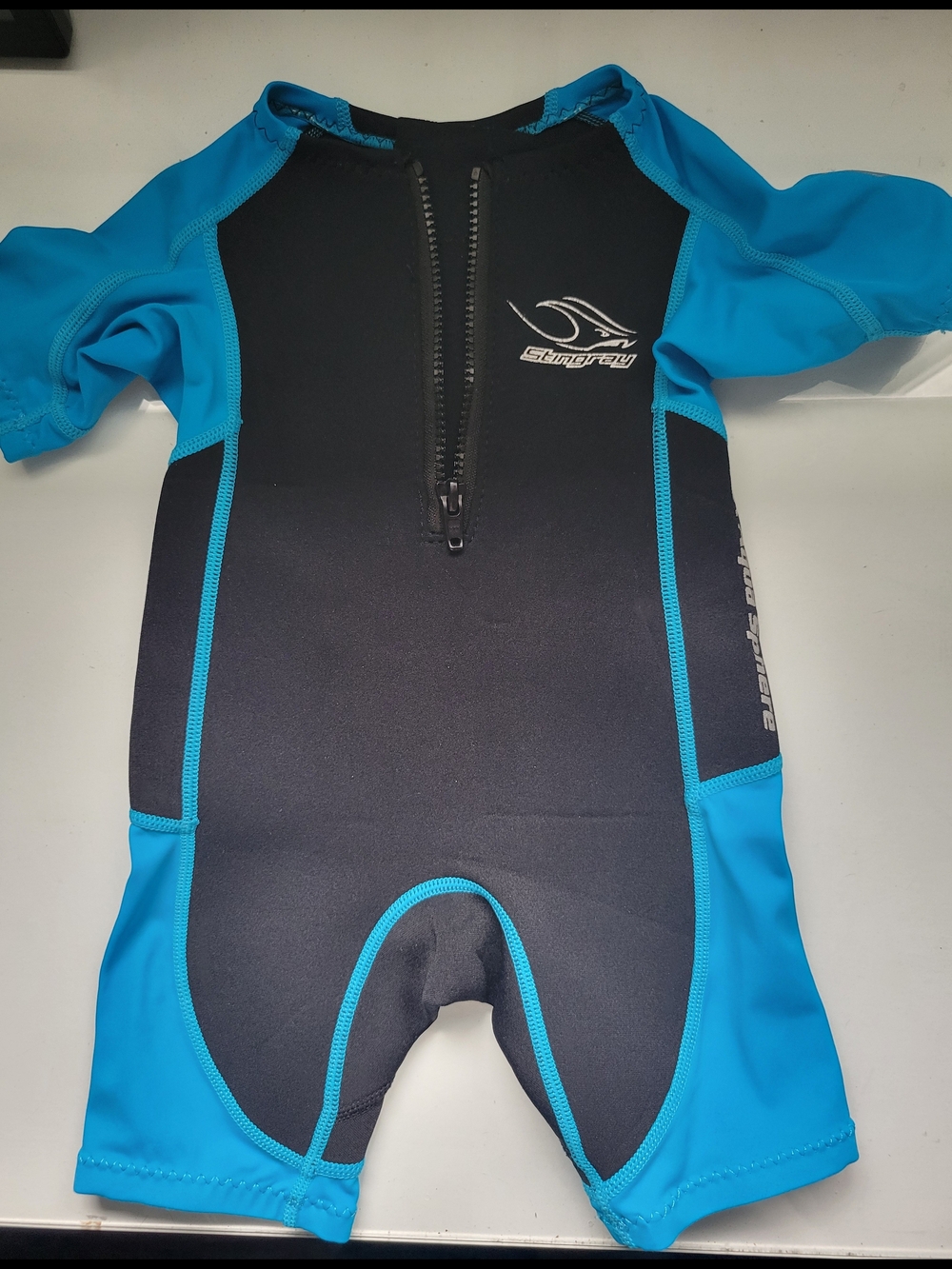 Storm Kids Black and Blue Short-Sleeve Front-Zip Swim Suit